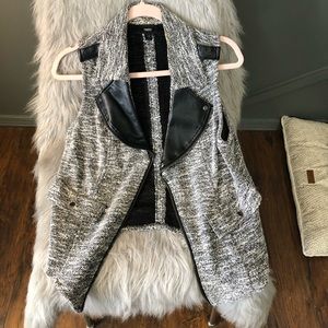 Grey vest.